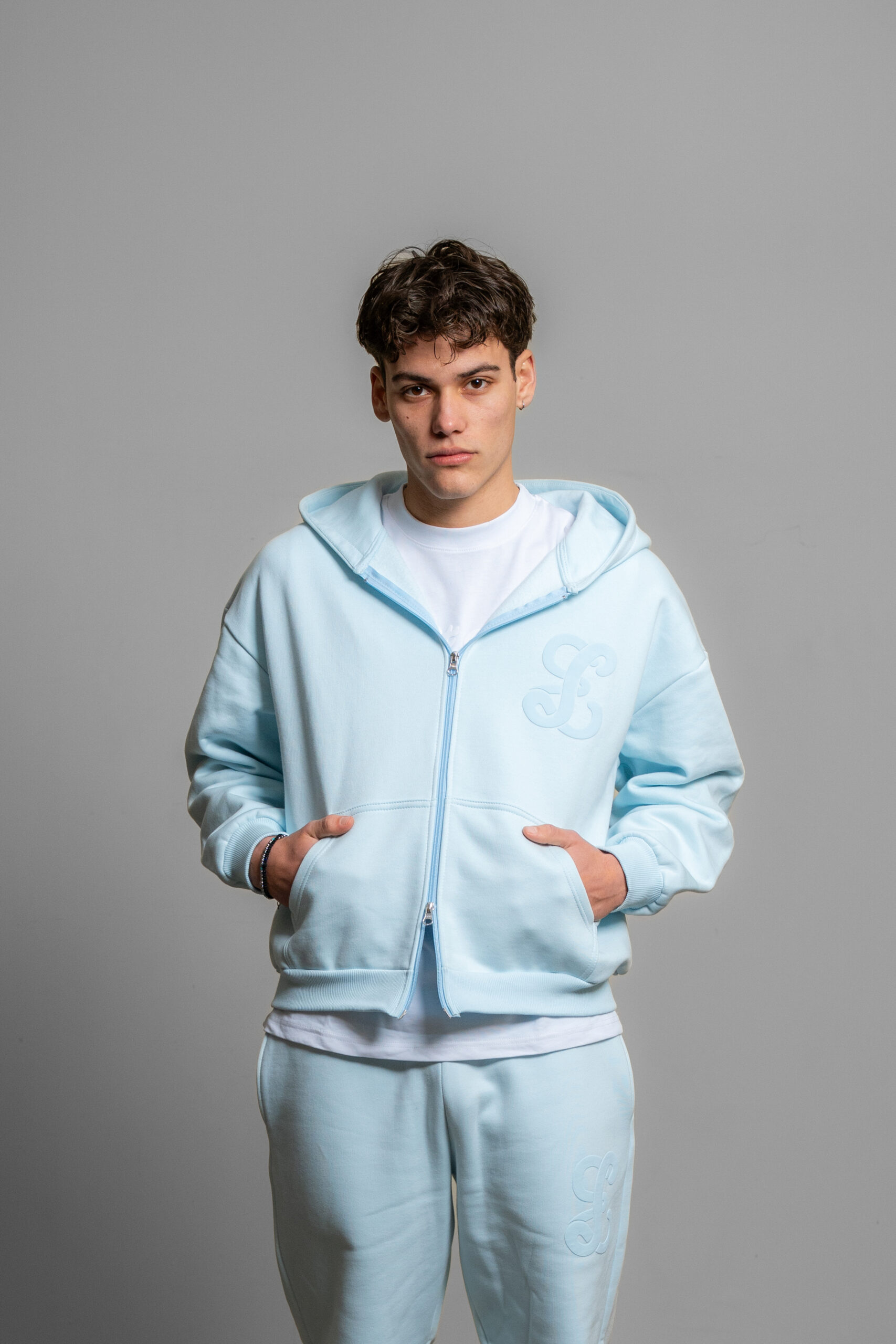 baby blue zip up worn by model