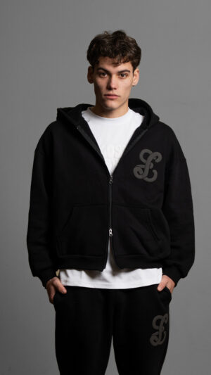 black zip up worn by model