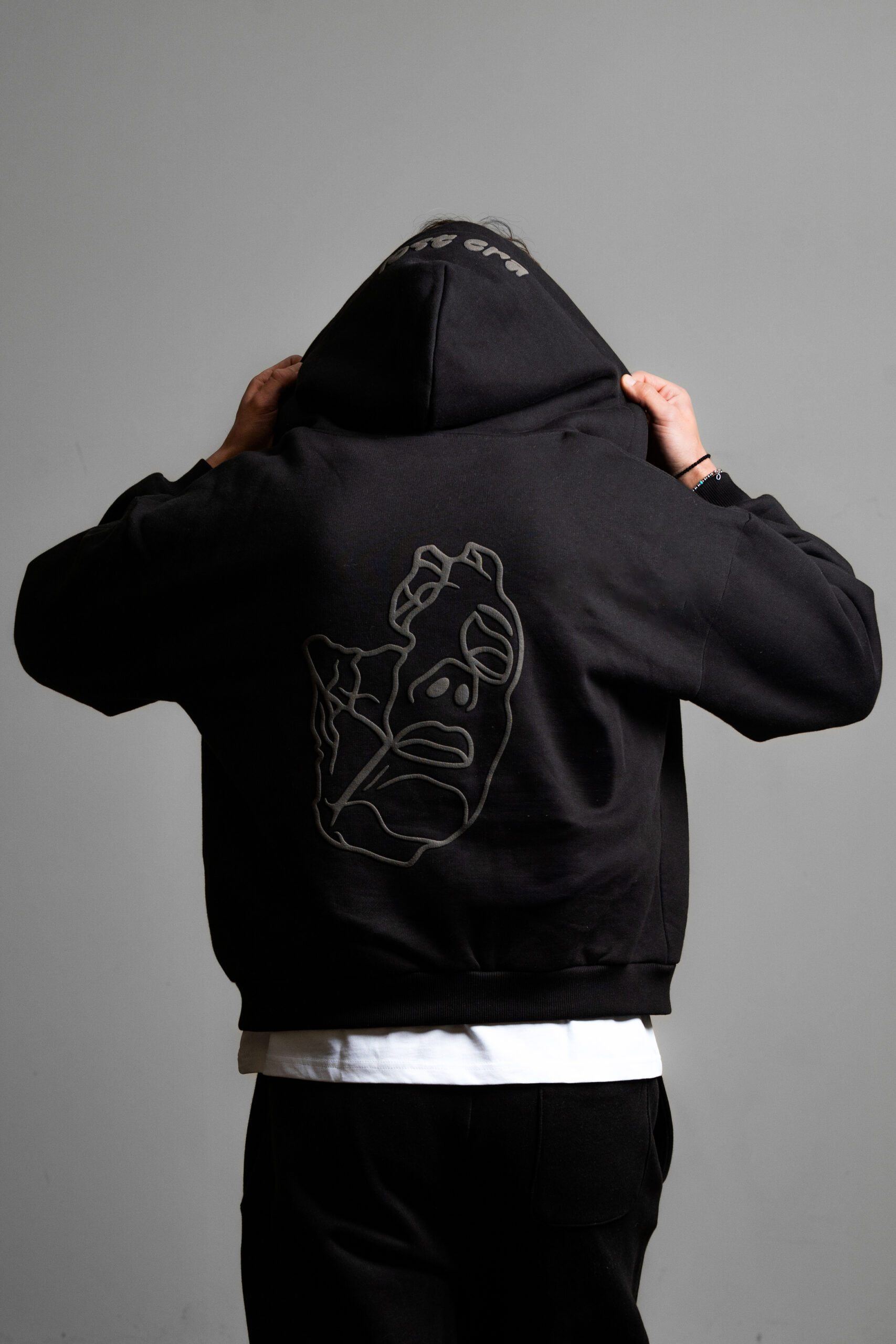 black zip up worn back view