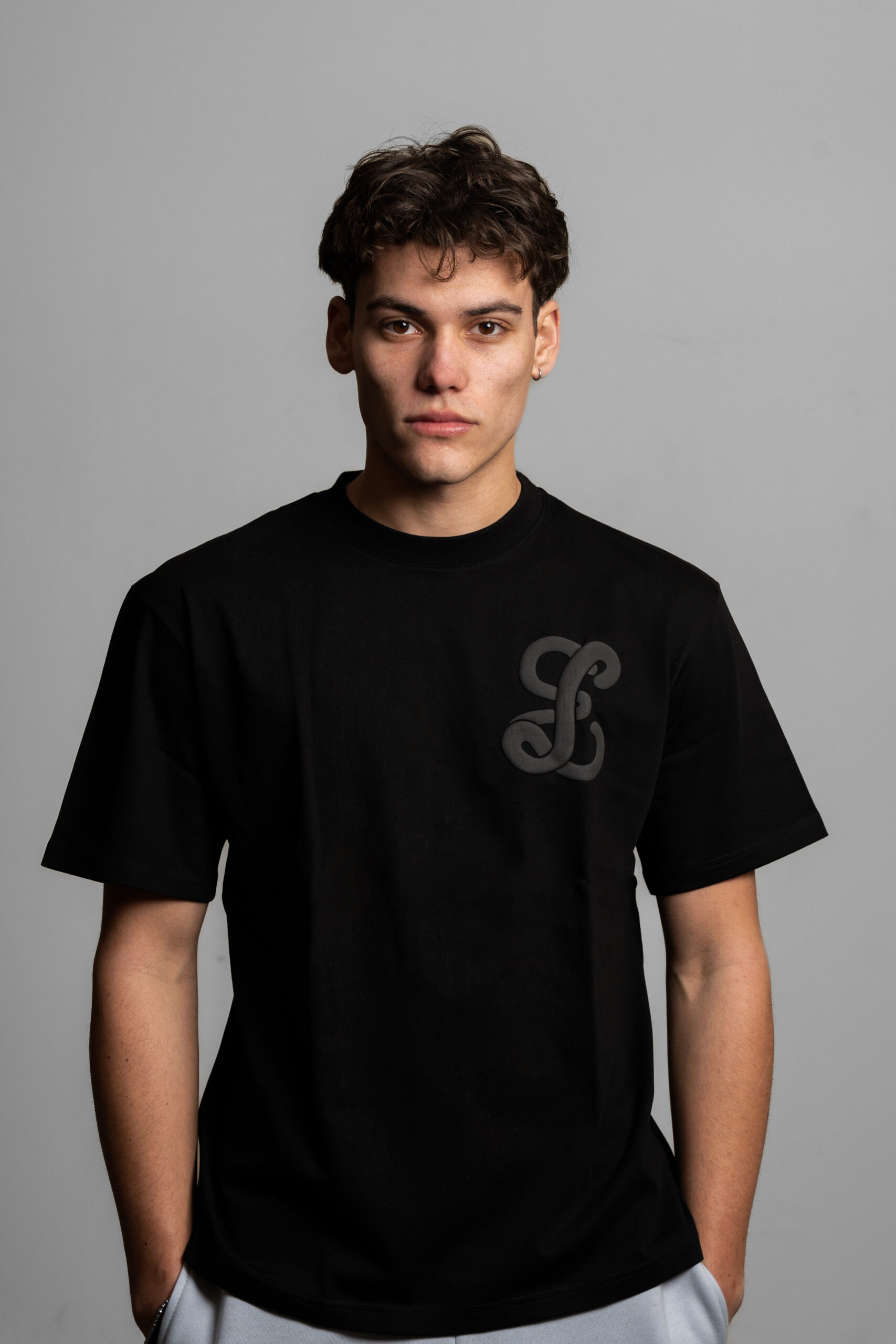 Lost Era black tee worn by model